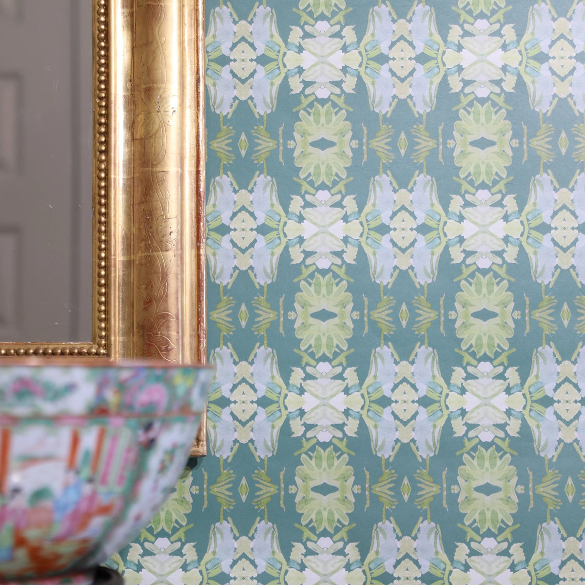 Luxury abstract floral wallpaper in rich dark green tones with layered organic movement, designed for modern traditional and collected interiors.
