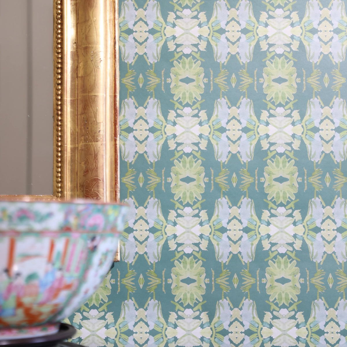 Luxury abstract floral wallpaper in rich dark green tones with layered organic movement, designed for modern traditional and collected interiors.