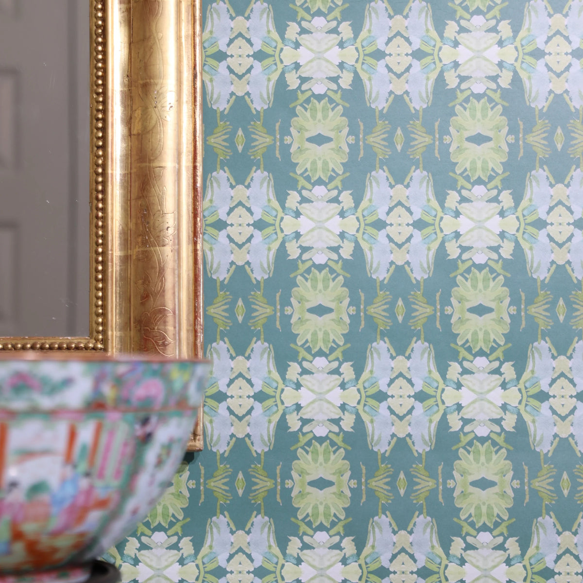 Luxury abstract floral wallpaper in rich dark green tones with layered organic movement, designed for modern traditional and collected interiors.