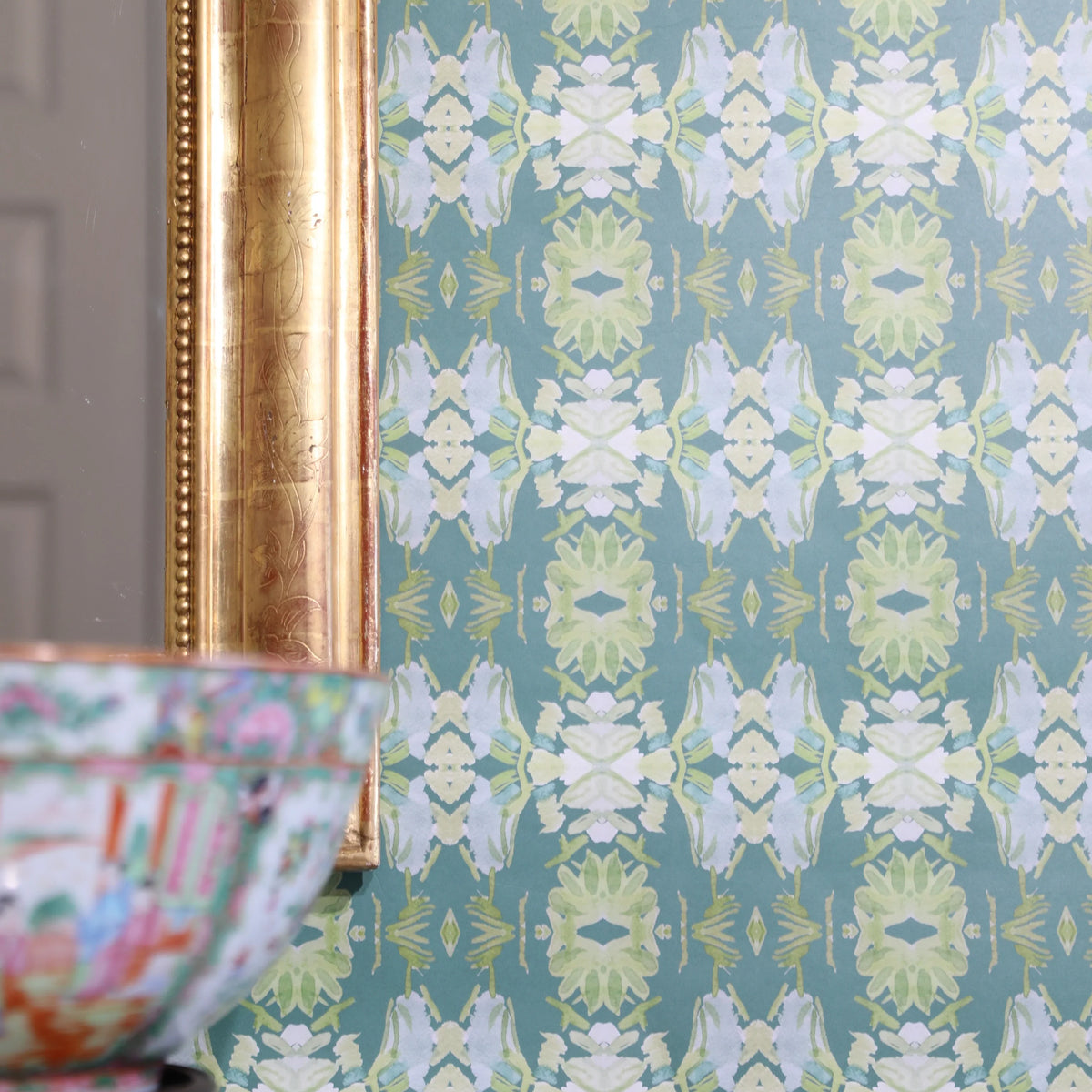 Luxury abstract floral wallpaper in rich dark green tones with layered organic movement, designed for modern traditional and collected interiors.