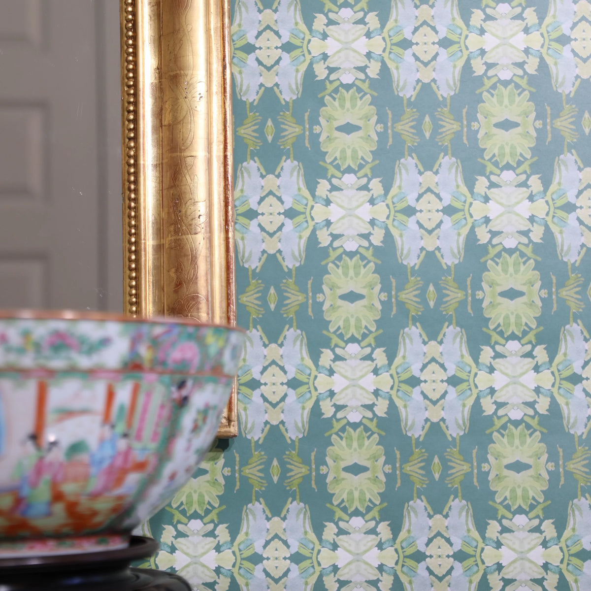 Luxury abstract floral wallpaper in rich dark green tones with layered organic movement, designed for modern traditional and collected interiors.