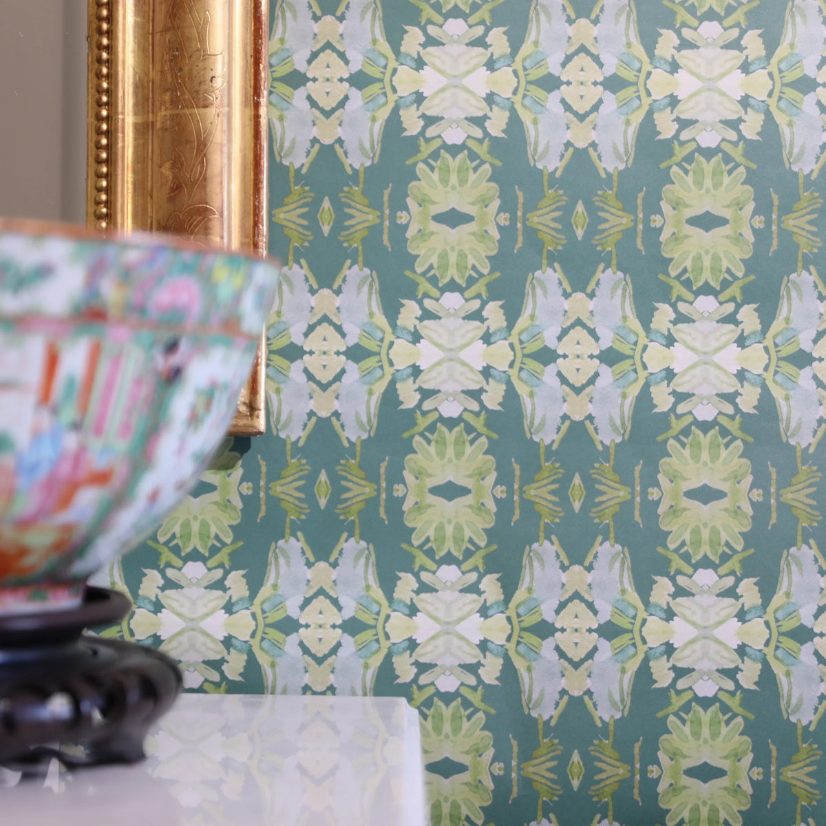 Luxury abstract floral wallpaper in rich dark green tones with layered organic movement, designed for modern traditional and collected interiors.