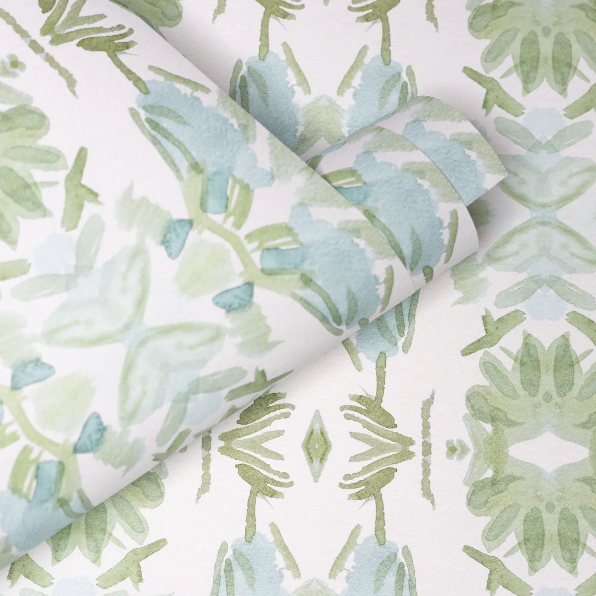 Luxury botanical wallpaper featuring an artistic wildflower-inspired pattern in sage green and soft blue, designed for modern traditional interiors, powder rooms, bedrooms, dining rooms, and collected homes.