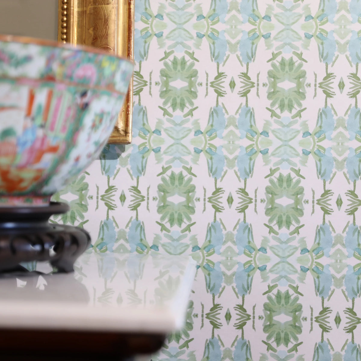 Luxury botanical wallpaper featuring an artistic wildflower-inspired pattern in sage green and soft blue, designed for modern traditional interiors, powder rooms, bedrooms, dining rooms, and collected homes.