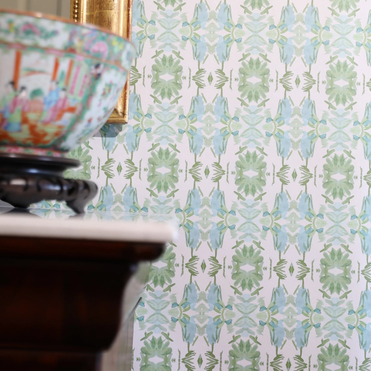 Luxury botanical wallpaper featuring an artistic wildflower-inspired pattern in sage green and soft blue, designed for modern traditional interiors, powder rooms, bedrooms, dining rooms, and collected homes.