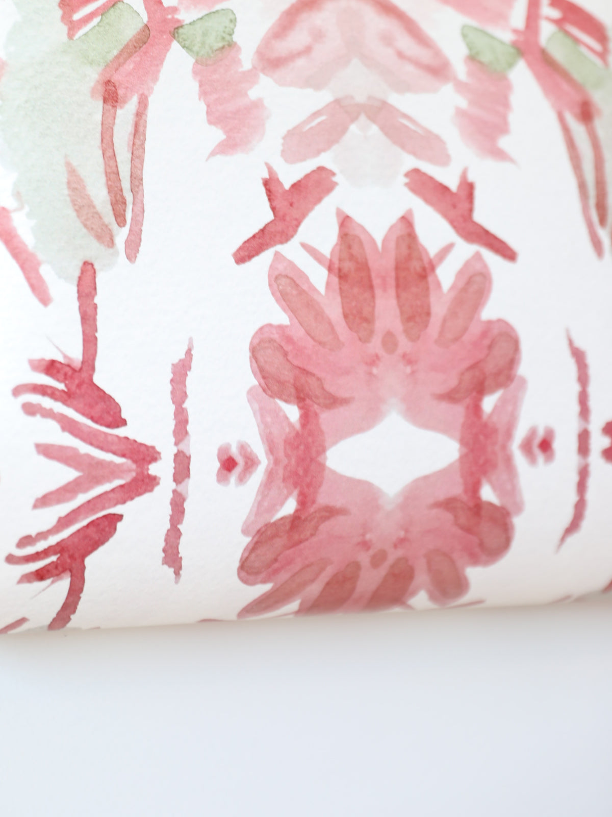 Luxury floral wallpaper featuring an artistic wildflower pattern in strawberry pink, blush, and soft green tones, designed for modern traditional interiors, bedrooms, powder rooms, and collected homes.