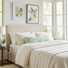Luxury jade green abstract bolster pillow with painterly organic design, handcrafted in England for contemporary and modern traditional interiors.