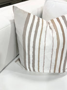 Brother Stripe in Neutrals Luxury Pillow by Truett Designs featuring an artistic stripe pattern in warm neutral tones. Handcrafted in England from sustainably printed luxury fabric, this designer decorative pillow adds structure, texture, and timeless elegance to sofas, beds, and accent chairs. A versatile favorite for interior designers, it pairs beautifully with florals, botanicals, grasscloth, natural linens, and tailored upholstery in luxury residential interiors.